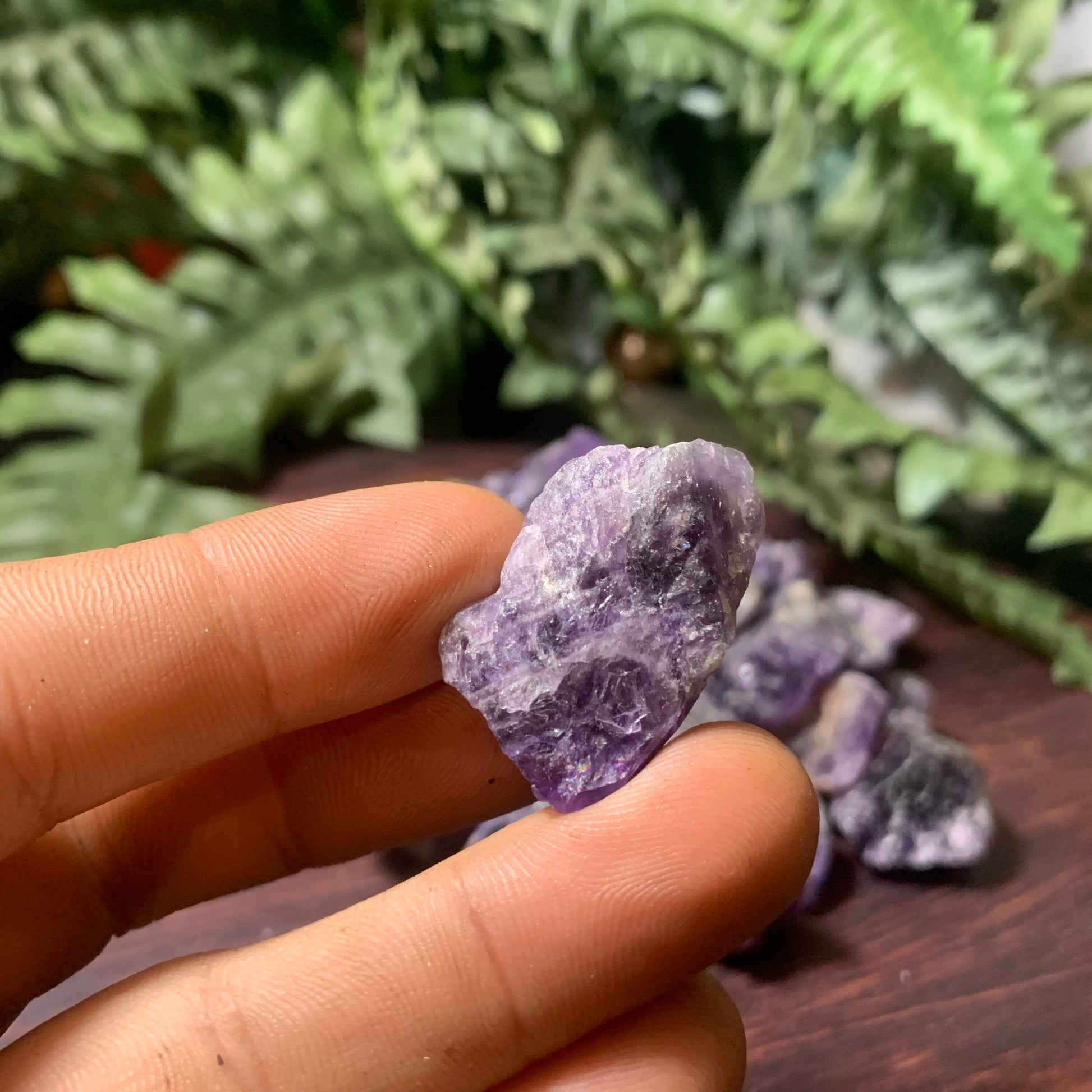 Raw Amethyst crystal (1”) close up hand