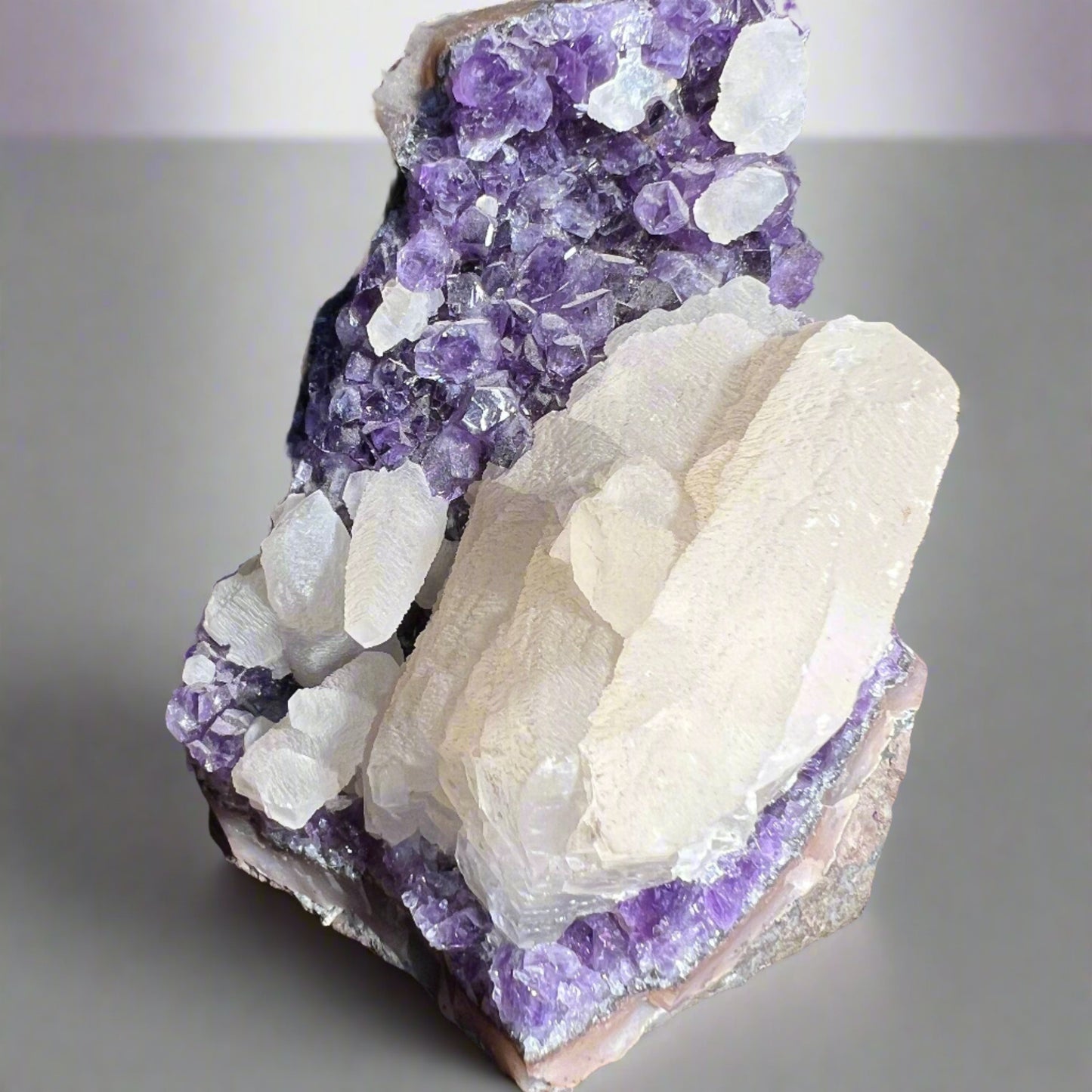 Super Close up of Amethyst Cluster with Calcite with indoor lighting